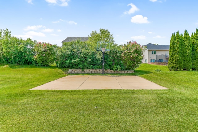 13589 Birch Rd, Rogers, MN 55374 - view of sport court featuring basketball court and a lawn