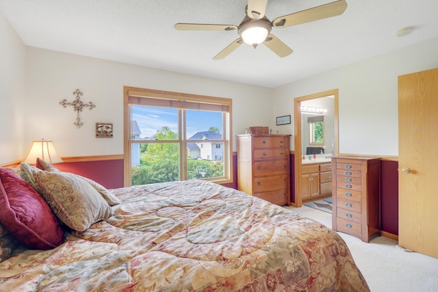 13589 Birch Rd, Rogers, MN 55374 - bedroom featuring light colored carpet, ceiling fan, and ensuite bathroom