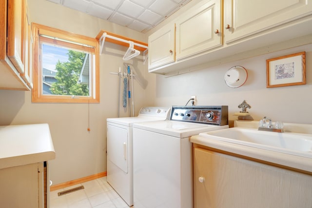 13589 Birch Rd, Rogers, MN 55374 - laundry room featuring cabinet space and washer and dryer