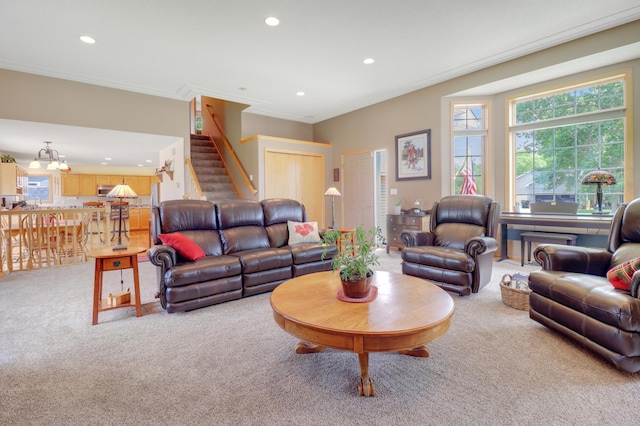 13589 Birch Rd, Rogers, MN 55374 - living area featuring carpet floors, recessed lighting, healthy amount of natural light, stairs, and crown molding