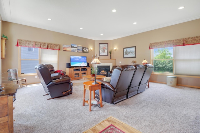 13589 Birch Rd, Rogers, MN 55374 - carpeted living area with recessed lighting, a glass covered fireplace, and ornamental molding