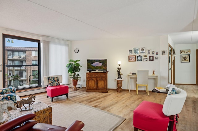 2601 Kenzie Ter Unit 402, Saint Anthony, MN 55418 - living room featuring wood finished floors and a baseboard radiator