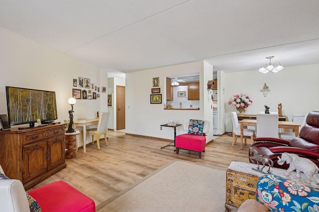 2601 Kenzie Ter Unit 402, Saint Anthony, MN 55418 - living room featuring light wood-style flooring and a chandelier