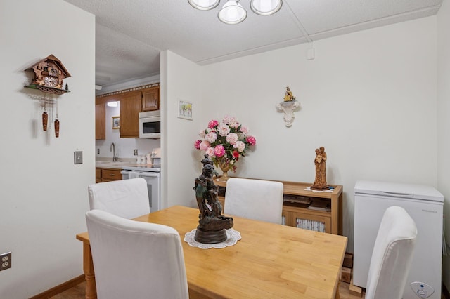 2601 Kenzie Ter Unit 402, Saint Anthony, MN 55418 - dining area featuring a chandelier