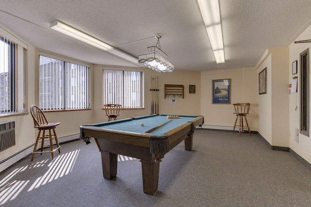 2601 Kenzie Ter Unit 402, Saint Anthony, MN 55418 - game room with dark colored carpet, a textured ceiling, billiards, and a baseboard radiator