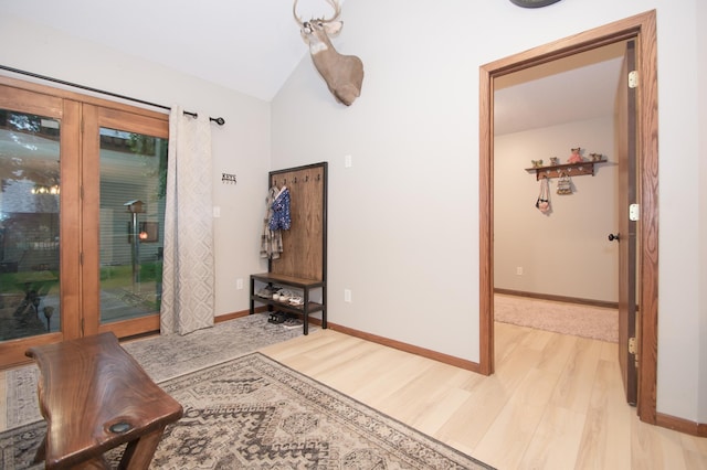 544 Auburn Pl NW Unit H, Elk River, MN 55330 - hallway with light wood-style floors and vaulted ceiling