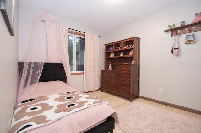 544 Auburn Pl NW Unit H, Elk River, MN 55330 - bedroom featuring light wood-type flooring