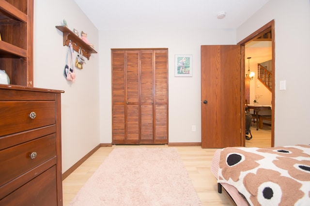 544 Auburn Pl NW Unit H, Elk River, MN 55330 - bedroom featuring a closet and light wood-style flooring