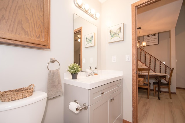 544 Auburn Pl NW Unit H, Elk River, MN 55330 - half bath featuring vanity and wood finished floors
