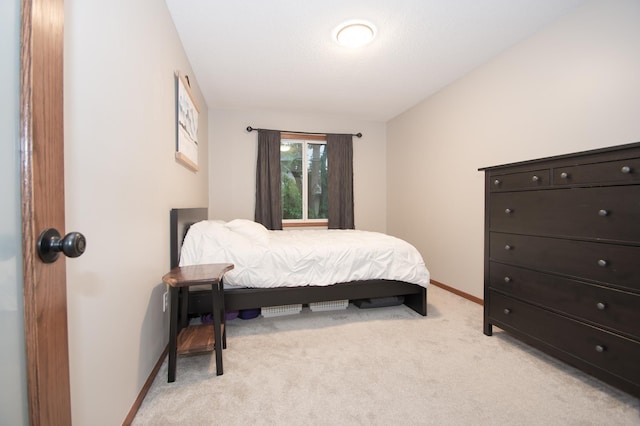 544 Auburn Pl NW Unit H, Elk River, MN 55330 - bedroom with light carpet and vaulted ceiling