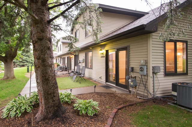 544 Auburn Pl NW Unit H, Elk River, MN 55330 - back of house with a patio area and a lawn