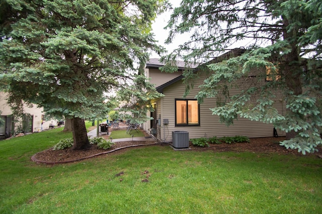 544 Auburn Pl NW Unit H, Elk River, MN 55330 - back of house with a lawn and a patio