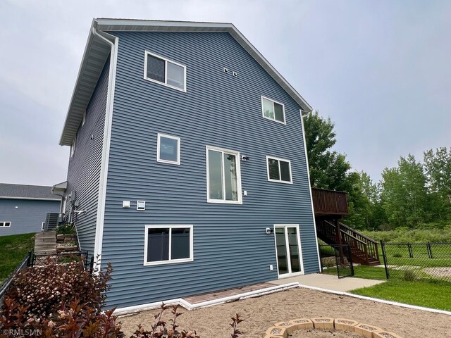 27 Benson Trl Unit 27, North Mankato, MN 56003 - rear view of property featuring stairs, a patio area, and a wooden deck