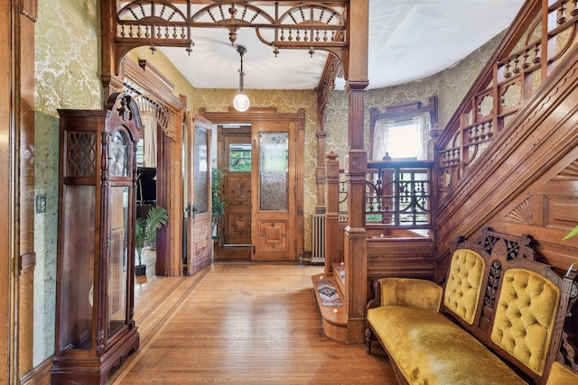 1601 Park Ave, Minneapolis, MN 55404 - foyer entrance featuring hardwood / wood-style floors, wallpapered walls, and stairway