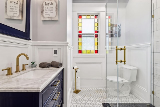 1601 Park Ave, Minneapolis, MN 55404 - full bathroom with a decorative wall, vanity, tile patterned floors, a wainscoted wall, and an enclosed shower