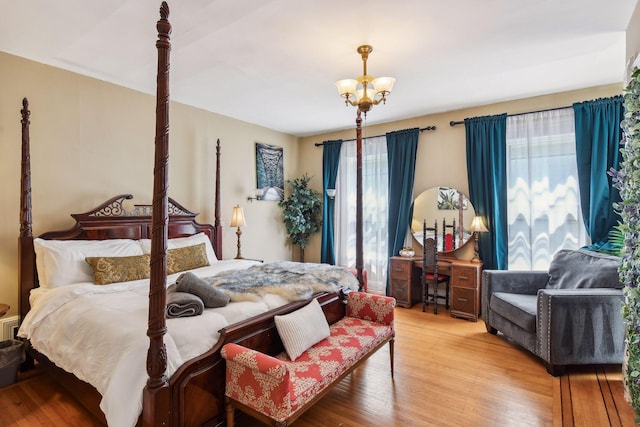1601 Park Ave, Minneapolis, MN 55404 - bedroom featuring light wood-style floors and a chandelier
