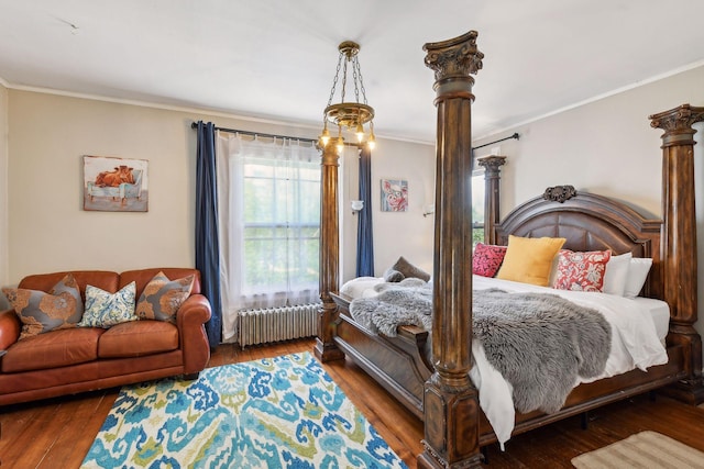 1601 Park Ave, Minneapolis, MN 55404 - bedroom with radiator, ornamental molding, and wood finished floors