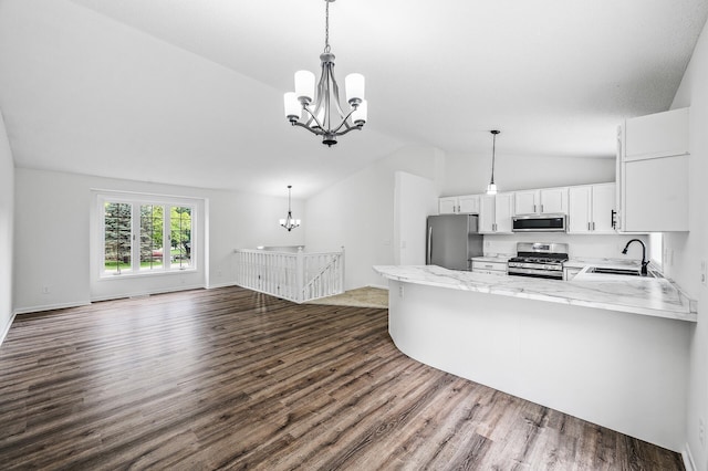 9211 Jeffery Ave S, Cottage Grove, MN 55016 - kitchen with appliances with stainless steel finishes, a chandelier, a sink, lofted ceiling, and dark wood-style floors