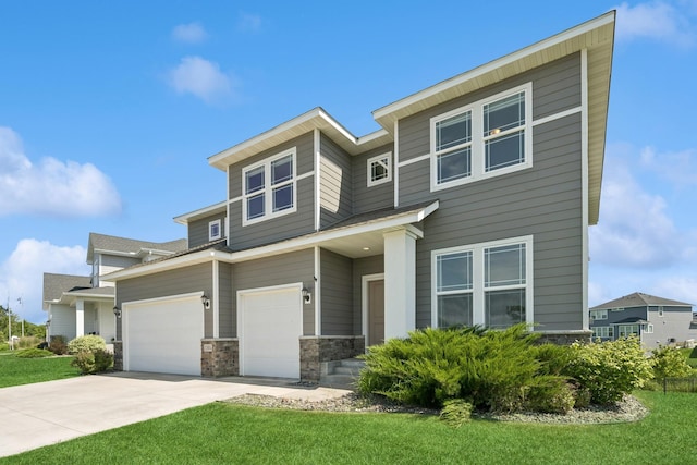 11604 Brayburn Trl, Dayton, MN 55369 - view of front of house with a front lawn, stone siding, driveway, and a garage