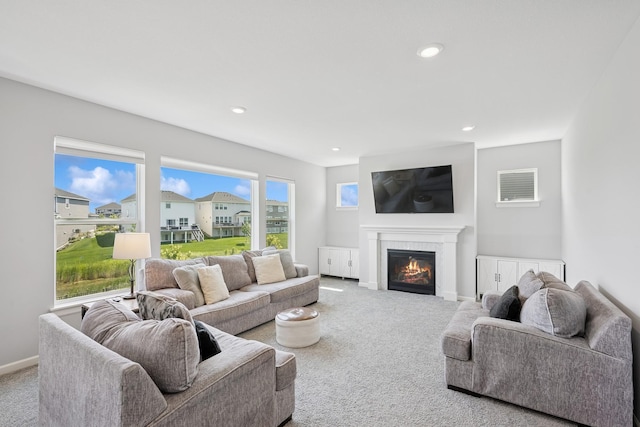 11604 Brayburn Trl, Dayton, MN 55369 - living area featuring carpet, a glass covered fireplace, and recessed lighting