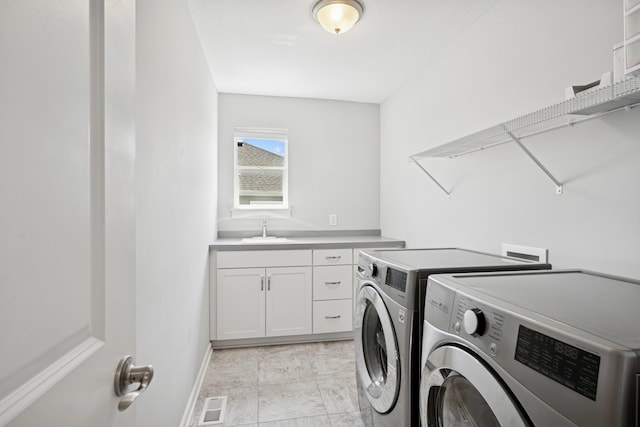 11604 Brayburn Trl, Dayton, MN 55369 - laundry room with washing machine and dryer and cabinet space