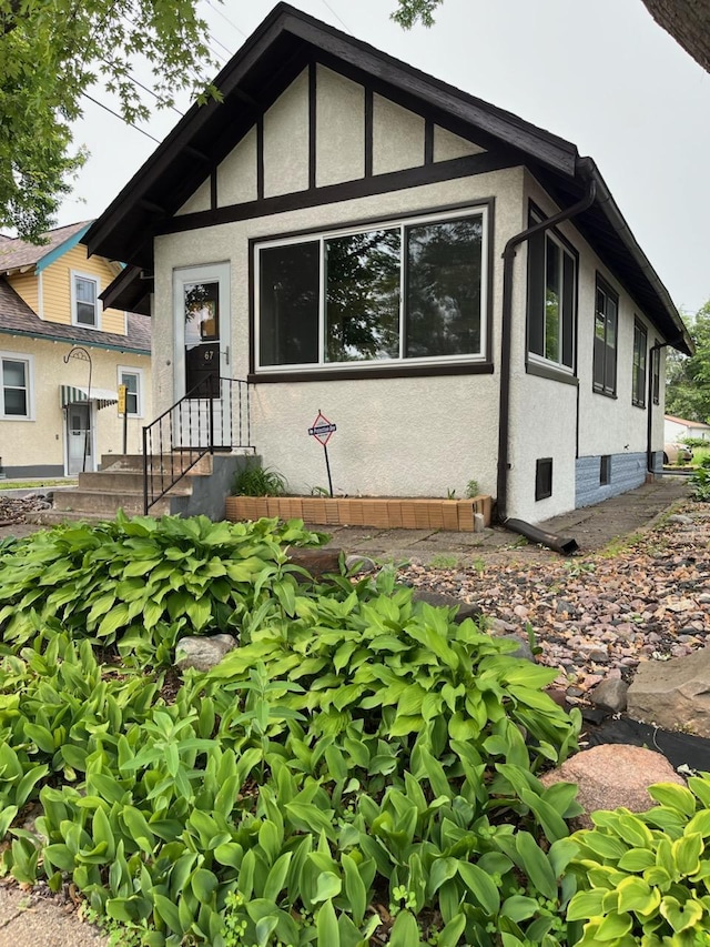 67 Lowry Ave NE, Minneapolis, MN 55418 - view of front of house with stucco siding