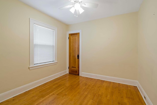 67 Lowry Ave NE, Minneapolis, MN 55418 - empty room featuring light wood finished floors and ceiling fan