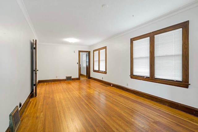 67 Lowry Ave NE, Minneapolis, MN 55418 - empty room featuring light wood finished floors and crown molding