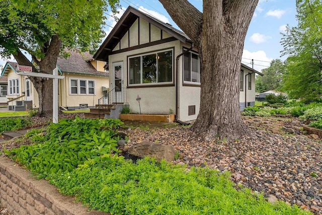 67 Lowry Ave NE, Minneapolis, MN 55418 - tudor-style house featuring stucco siding