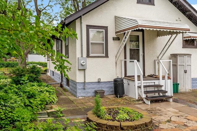 67 Lowry Ave NE, Minneapolis, MN 55418 - view of front of property featuring stucco siding