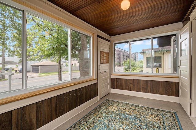 67 Lowry Ave NE, Minneapolis, MN 55418 - unfurnished sunroom with healthy amount of natural light, wood ceiling, and wood walls