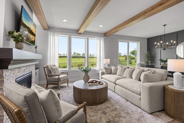 17660 Jett Cir, Prior Lake, MN 55372 - living room with a chandelier, beamed ceiling, and a fireplace