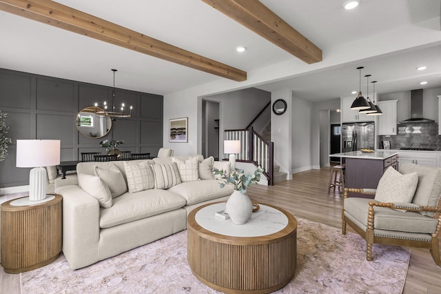 17660 Jett Cir, Prior Lake, MN 55372 - living area with a decorative wall, stairway, light wood-style floors, recessed lighting, and a chandelier