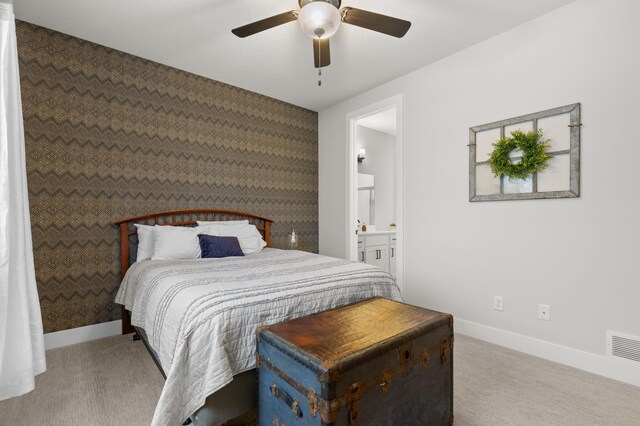17660 Jett Cir, Prior Lake, MN 55372 - carpeted bedroom with an accent wall, ensuite bathroom, and ceiling fan