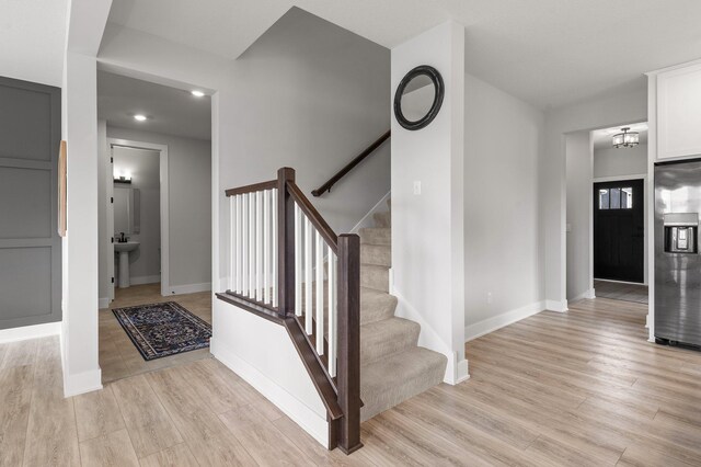17660 Jett Cir, Prior Lake, MN 55372 - stairs with wood finished floors and a chandelier