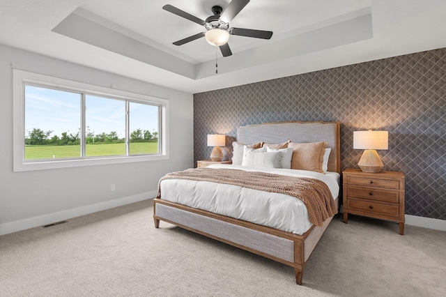 17660 Jett Cir, Prior Lake, MN 55372 - bedroom with a raised ceiling, light carpet, and ceiling fan