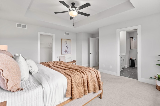 17660 Jett Cir, Prior Lake, MN 55372 - bedroom with a tray ceiling, carpet, a walk in closet, a closet, and ensuite bath