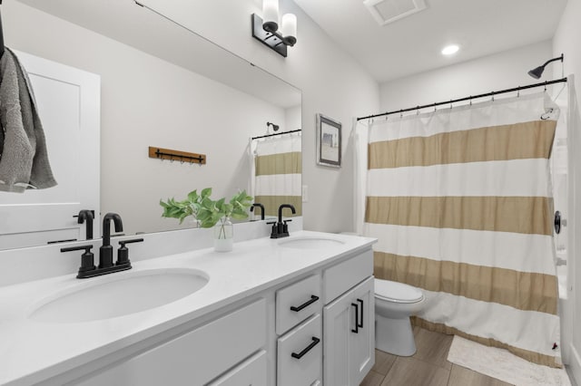 17660 Jett Cir, Prior Lake, MN 55372 - full bathroom featuring double vanity, shower / bath combination with curtain, wood finished floors, and recessed lighting
