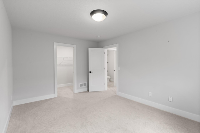 17660 Jett Cir, Prior Lake, MN 55372 - unfurnished bedroom with light carpet, a walk in closet, and a closet