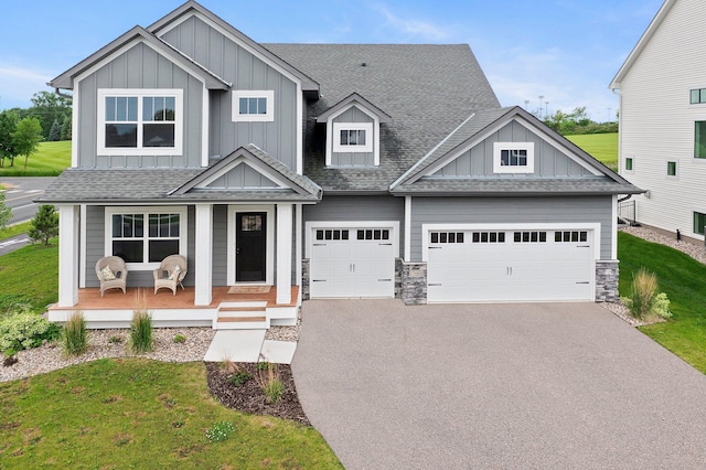 17660 Jett Cir, Prior Lake, MN 55372 - craftsman inspired home with board and batten siding, driveway, a porch, a front lawn, and a shingled roof