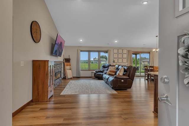 83 Meadow Ln, Cold Spring, MN 56320 - living area featuring a fireplace, recessed lighting, light wood finished floors, and baseboards