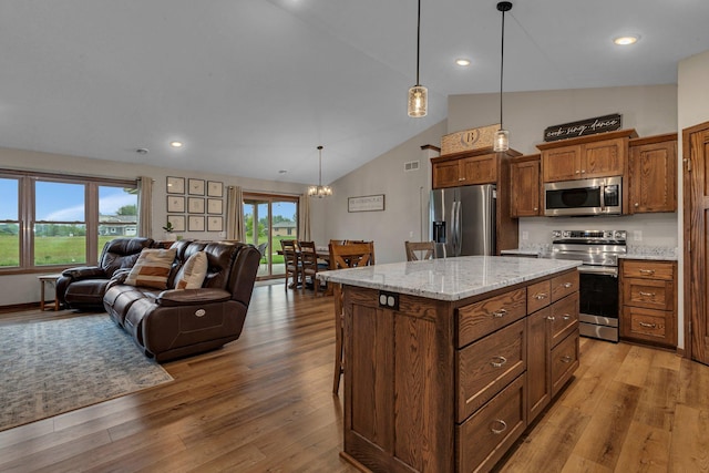 83 Meadow Ln, Cold Spring, MN 56320 - kitchen with appliances with stainless steel finishes, open floor plan, hardwood / wood-style flooring, pendant lighting, and recessed lighting