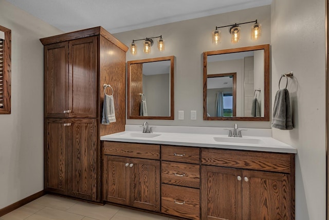 83 Meadow Ln, Cold Spring, MN 56320 - bathroom featuring double vanity, tile patterned floors, and baseboards