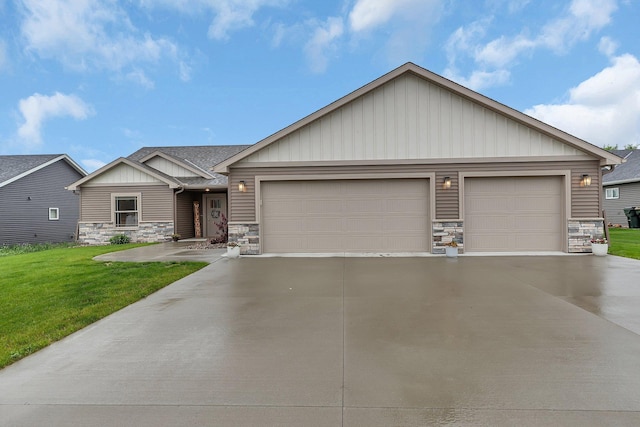 83 Meadow Ln, Cold Spring, MN 56320 - view of front of home with stone siding, concrete driveway, a garage, board and batten siding, and a front lawn
