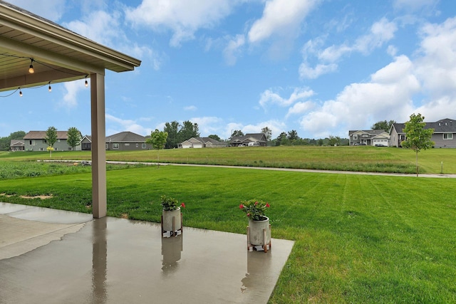 83 Meadow Ln, Cold Spring, MN 56320 - view of grassy yard featuring a patio area and a residential view