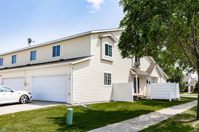 2383 58th Ave S Unit A, Fargo, ND 58104 - view of front facade featuring an attached garage, a front yard, and driveway