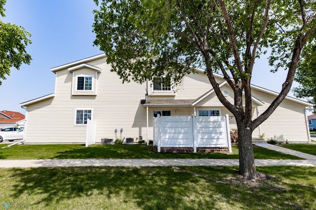2383 58th Ave S Unit A, Fargo, ND 58104 - view of home's exterior featuring mail area and a lawn
