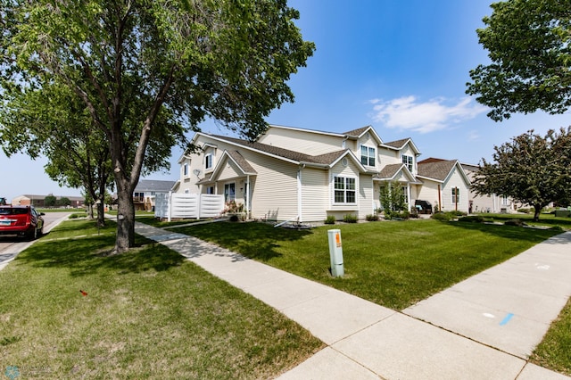 2383 58th Ave S Unit A, Fargo, ND 58104 - traditional-style home featuring a front lawn