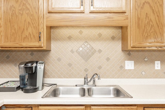 2383 58th Ave S Unit A, Fargo, ND 58104 - kitchen featuring light countertops, tasteful backsplash, and light brown cabinets