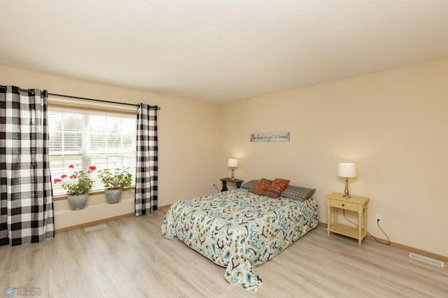 2383 58th Ave S Unit A, Fargo, ND 58104 - bedroom featuring wood finished floors